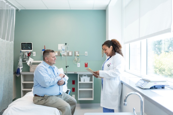 Doctor reviewing medical history with her patient
