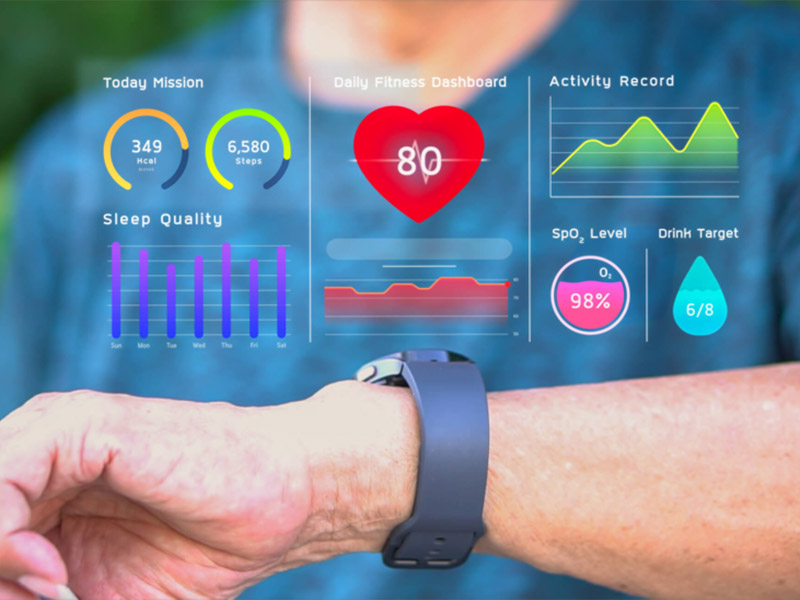 Wrist wearing smartwatch showing health and fitness data